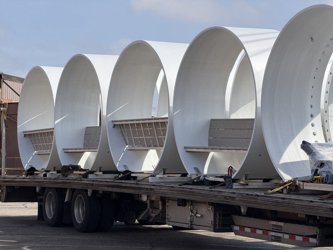 Noblewins benches made from recycled wind turbine blades loaded on a flatbed truck for delivery