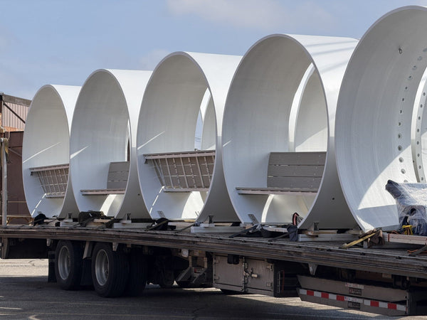 Noblewins benches made from recycled wind turbine blades loaded on a flatbed truck for delivery